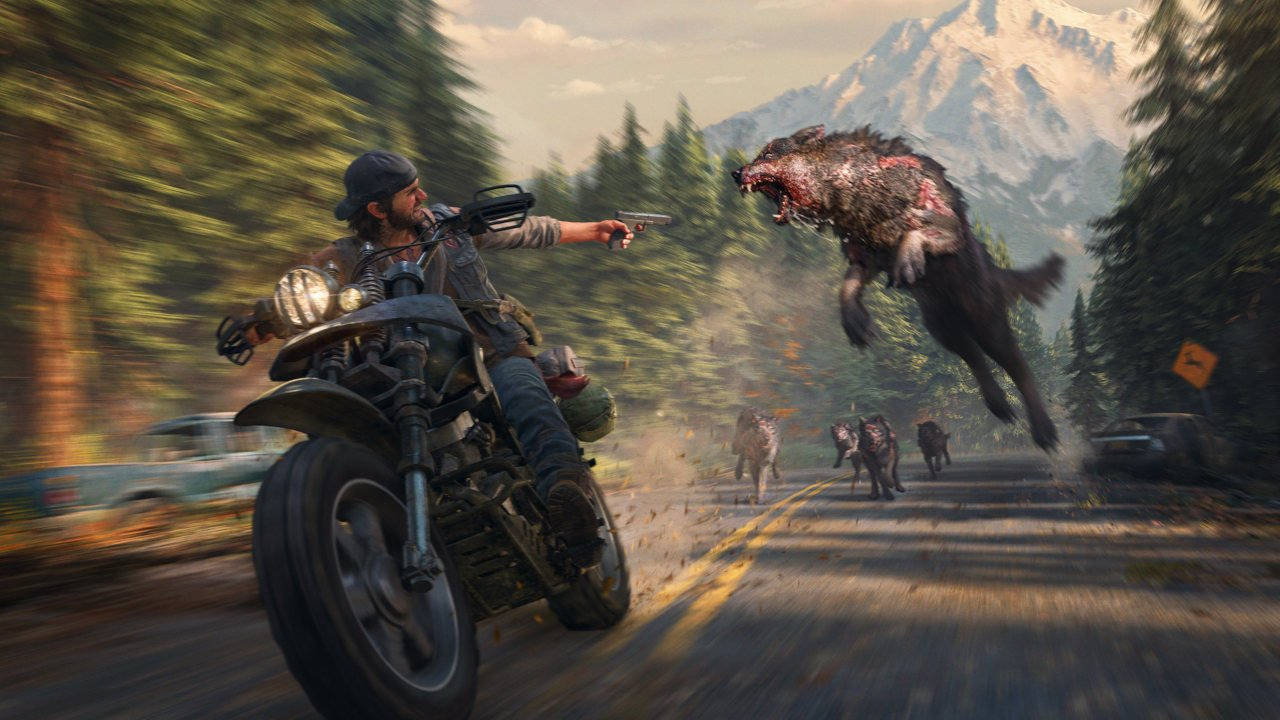 Days Gone - główny bohater ucieka na motorze przed wilkami - PlayStation