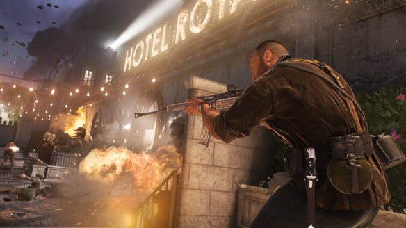 Call of Duty Vanguard - żołnierz za osłoną strzela do przeciwników w mieście