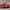 Gran Turismo 7 - czerwony sportowy samochód na tle skał