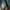 Screen z gry Clair Obscur: Expedition 33 - nagrody w naszym giveaway'u. Przedstawia bohaterkę spoglądającą na magiczny, świecący przedmiot.