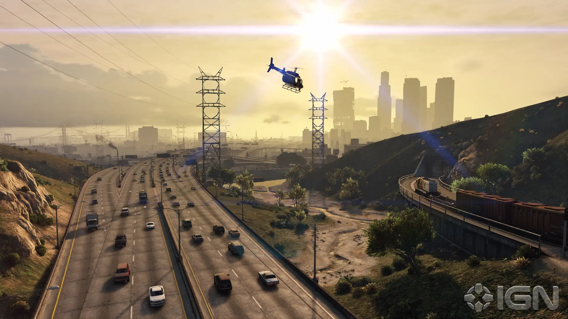 Aerial view of a highway with vehicles and a helicopter flying overhead.