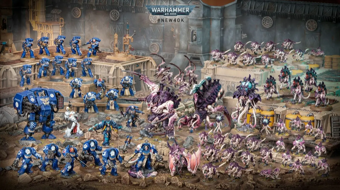 Detailed Warhammer 40,000 miniature models depicting chaos and space marine factions.